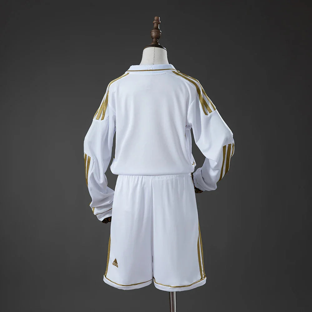 Conjunto infantil de manga larga del Real Madrid primera equipación 11/12 con la espalda lisa - vista trasera