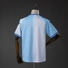 Camiseta especial del Málaga 26/27 partida en blanco y azul celeste - vista trasera
