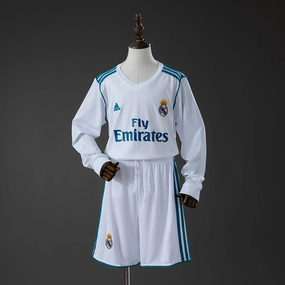 Conjunto infantil de manga larga del Real Madrid primera equipación 17/18 blanco y turquesa - vista frontal