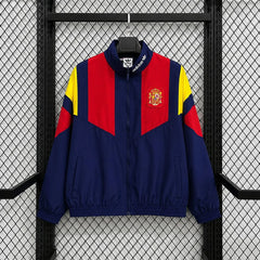 Chaqueta cortavientos España 2026 azul marino y rojo - vista frontal